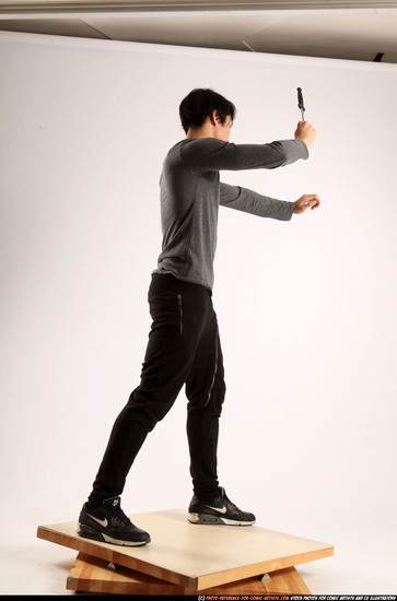 Man Young Athletic Fighting with knife Standing poses Casual Asian