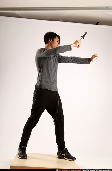 Man Young Athletic Fighting with knife Standing poses Casual Asian