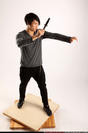 Man Young Athletic Fighting with knife Standing poses Casual Asian