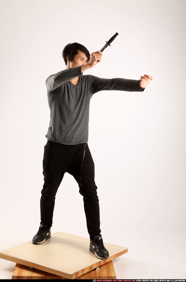 Man Young Athletic Fighting with knife Standing poses Casual Asian