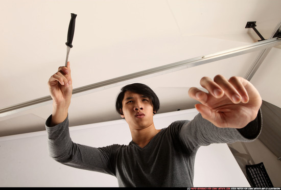 Man Young Athletic Fighting with knife Standing poses Casual Asian