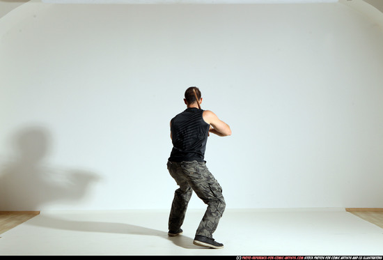 Man Adult Athletic White Fighting with sword Moving poses Casual