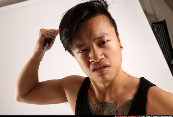 Man Young Athletic Fighting with knife Standing poses Casual Asian