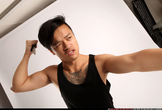 Man Young Athletic Fighting with knife Standing poses Casual Asian