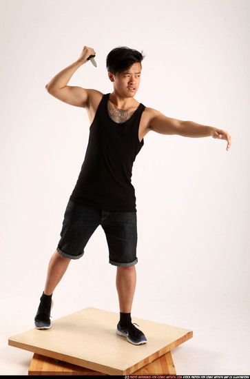 Man Young Athletic Fighting with knife Standing poses Casual Asian