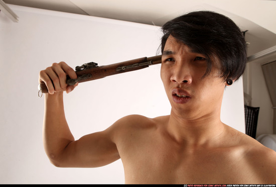 Man Young Athletic Fighting with gun Standing poses Pants Asian