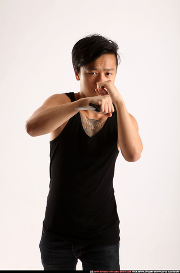 Man Young Athletic Fighting with knife Standing poses Casual Asian