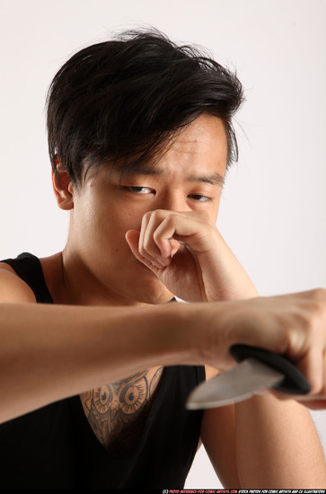 Man Young Athletic Fighting with knife Standing poses Casual Asian