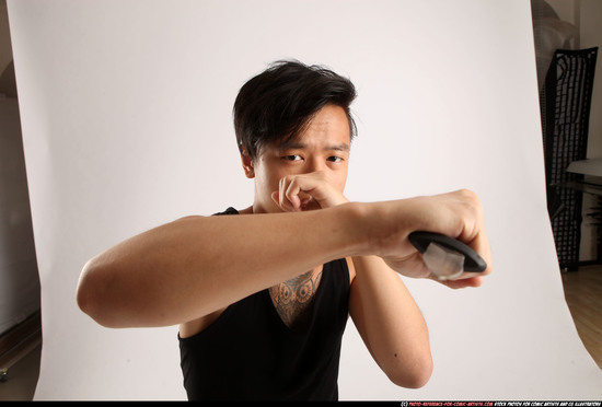 Man Young Athletic Fighting with knife Standing poses Casual Asian