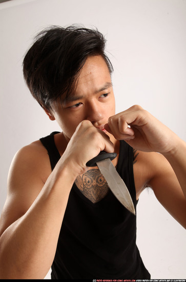 Man Young Athletic Fighting with knife Standing poses Casual Asian