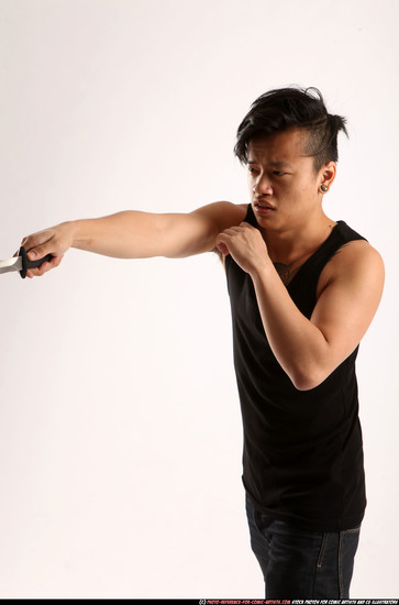 Man Young Athletic Fighting with knife Standing poses Casual Asian