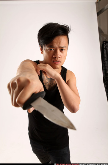 Man Young Athletic Fighting with knife Standing poses Casual Asian