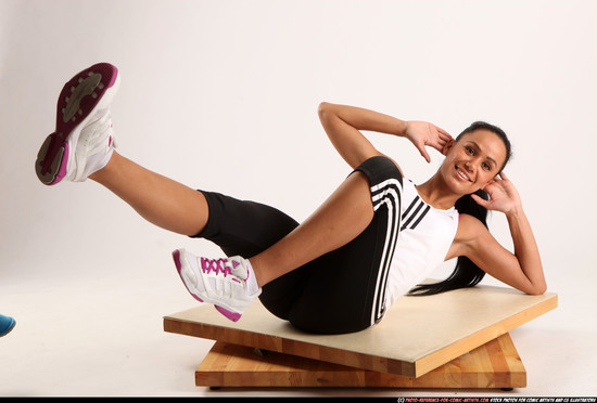 Woman Young Athletic Fitness poses Laying poses Sportswear Latino