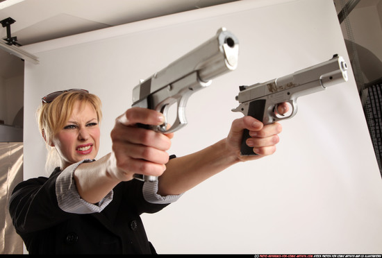 Woman Adult Athletic White Fighting with gun Standing poses Coat