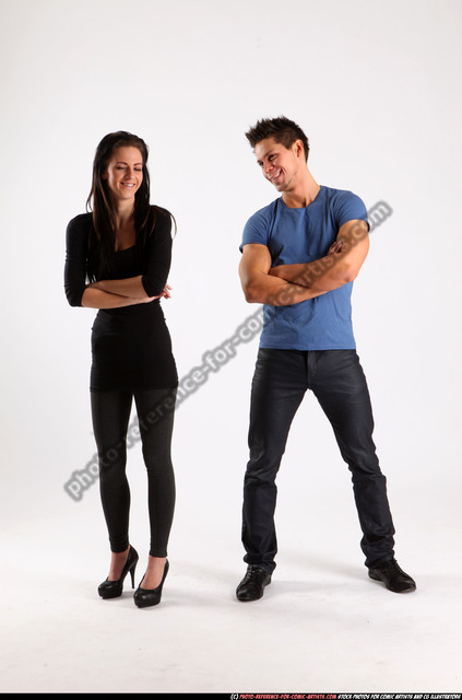 Full Length Portrait Of Happy Young Asian Couple In Casual Clothes Hugging  And Looking At Camera Against White Wall Stock Photo - Download Image Now -  iStock