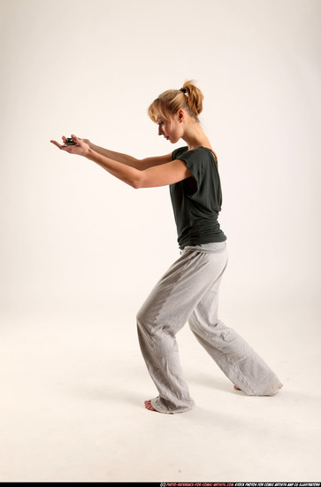 Woman Adult Athletic White Fighting with sword Standing poses Casual