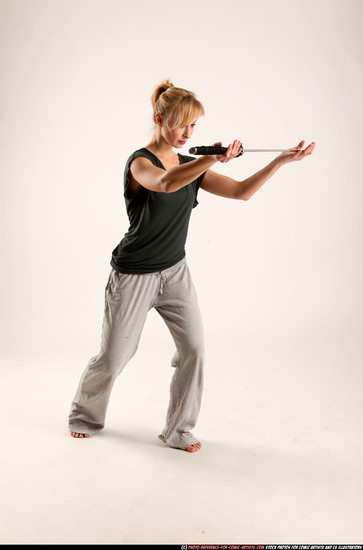 Woman Adult Athletic White Fighting with sword Standing poses Casual