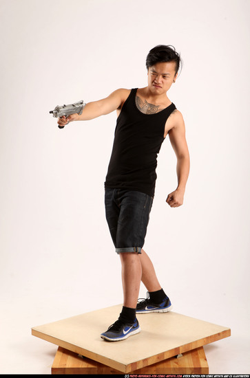 Man Young Athletic Fighting with submachine gun Standing poses Casual Asian