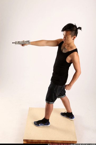 Man Young Athletic Fighting with submachine gun Standing poses Casual Asian