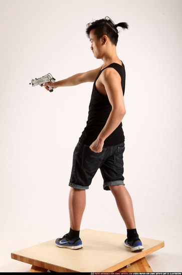 Man Young Athletic Fighting with submachine gun Standing poses Casual Asian