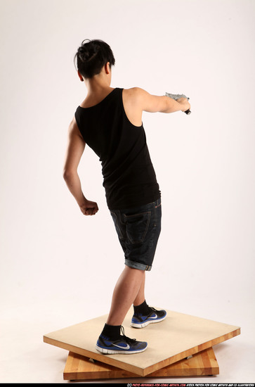 Man Young Athletic Fighting with submachine gun Standing poses Casual Asian