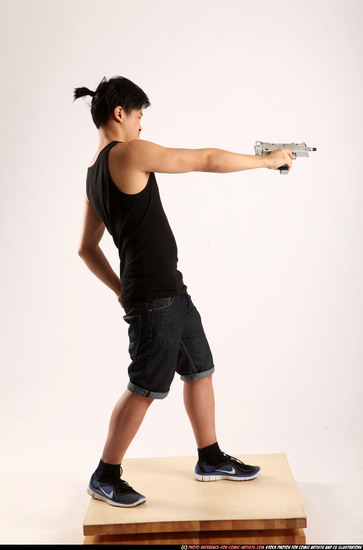 Man Young Athletic Fighting with submachine gun Standing poses Casual Asian