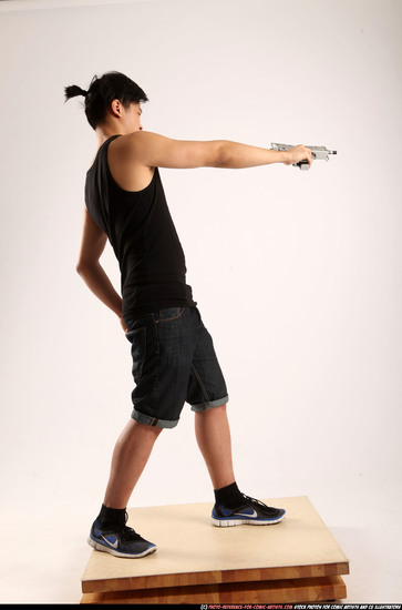 Man Young Athletic Fighting with submachine gun Standing poses Casual Asian