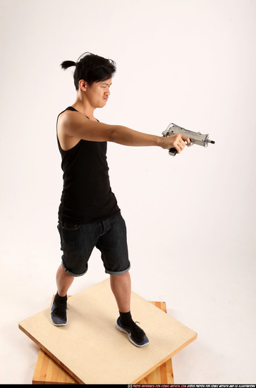 Man Young Athletic Fighting with submachine gun Standing poses Casual Asian