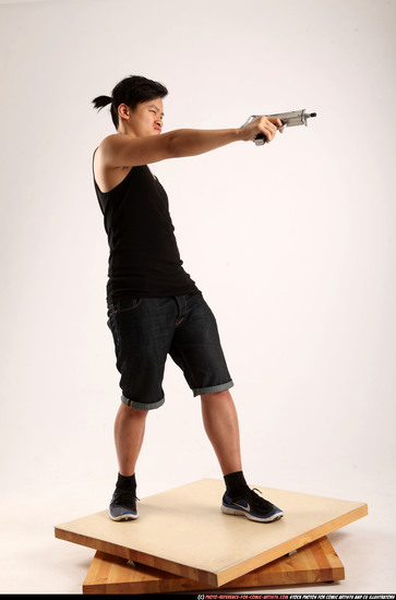 Man Young Athletic Fighting with submachine gun Standing poses Casual Asian