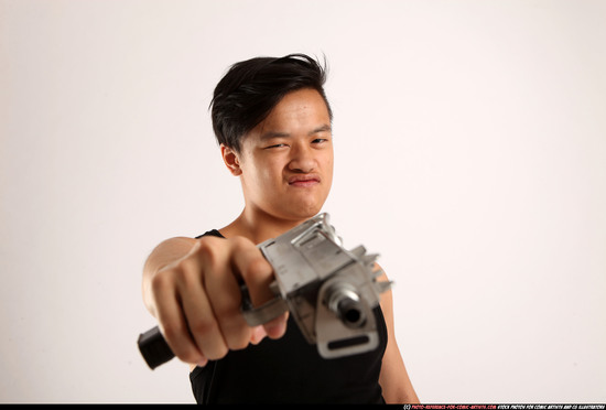 Man Young Athletic Fighting with submachine gun Standing poses Casual Asian