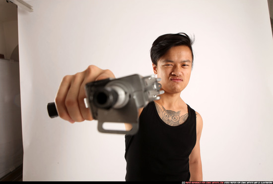 Man Young Athletic Fighting with submachine gun Standing poses Casual Asian