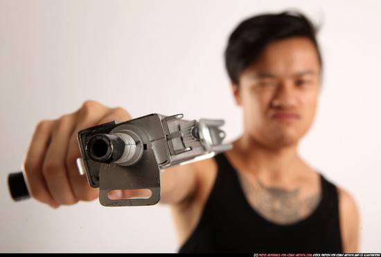 Man Young Athletic Fighting with submachine gun Standing poses Casual Asian