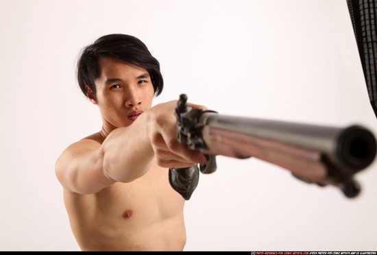 Man Young Athletic Fighting with gun Kneeling poses Pants Asian