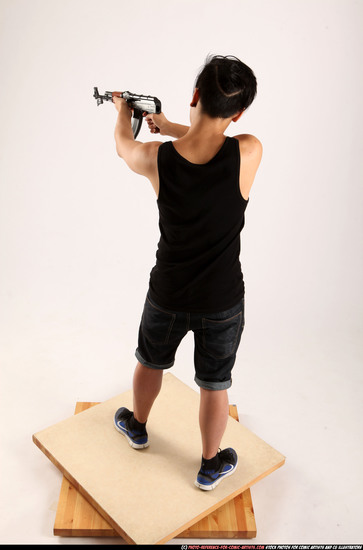 Man Young Athletic Fighting with submachine gun Standing poses Casual Asian