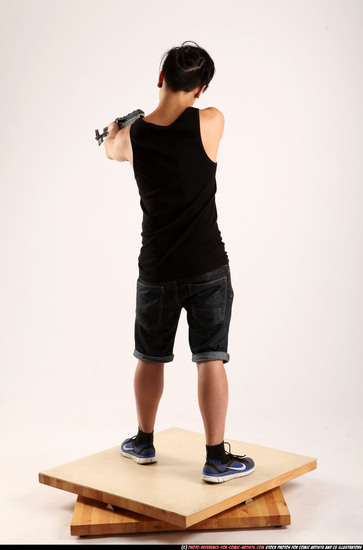 Man Young Athletic Fighting with submachine gun Standing poses Casual Asian