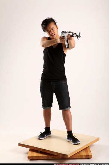 Man Young Athletic Fighting with submachine gun Standing poses Casual Asian