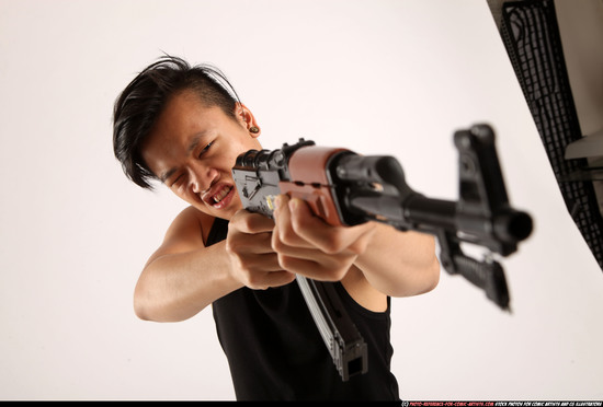 Man Young Athletic Fighting with submachine gun Standing poses Casual Asian