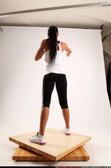 Woman Young Athletic Fitness poses Standing poses Sportswear Latino