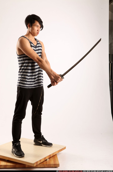 Man Young Athletic Fighting with sword Standing poses Casual Asian