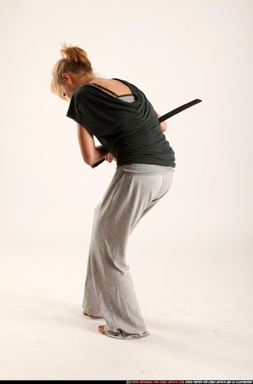 Woman Adult Athletic White Fighting with sword Moving poses Casual