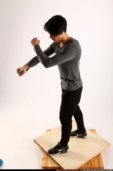 Man Young Athletic Fighting with knife Standing poses Casual Asian