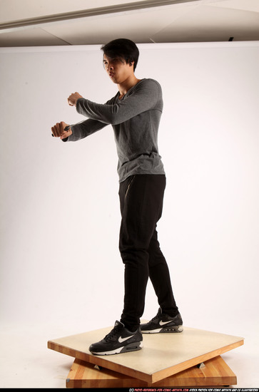 Man Young Athletic Fighting with knife Standing poses Casual Asian