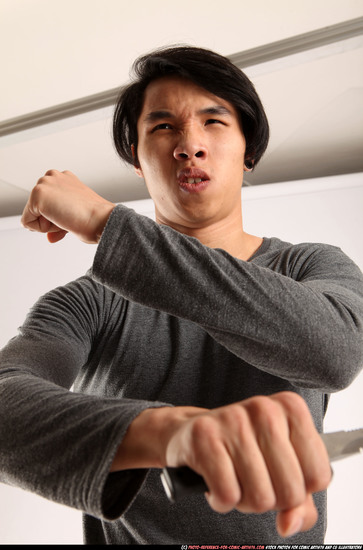 Man Young Athletic Fighting with knife Standing poses Casual Asian