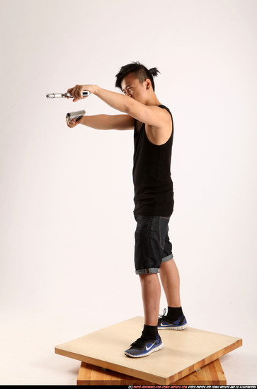 Man Young Athletic Fighting with gun Standing poses Casual Asian