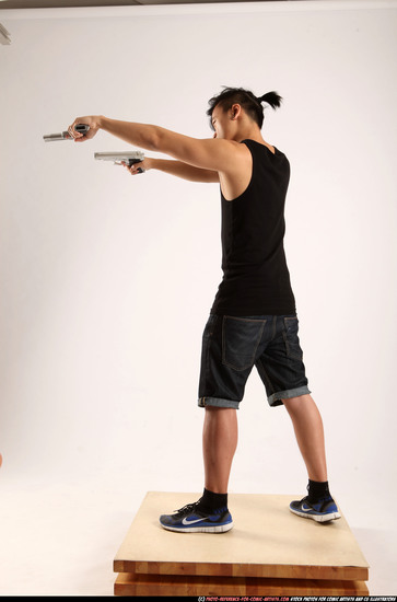 Man Young Athletic Fighting with gun Standing poses Casual Asian