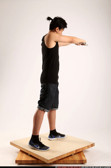 Man Young Athletic Fighting with gun Standing poses Casual Asian