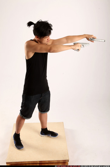 Man Young Athletic Fighting with gun Standing poses Casual Asian