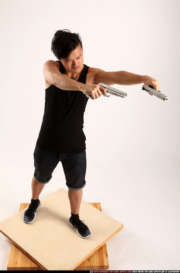 Man Young Athletic Fighting with gun Standing poses Casual Asian