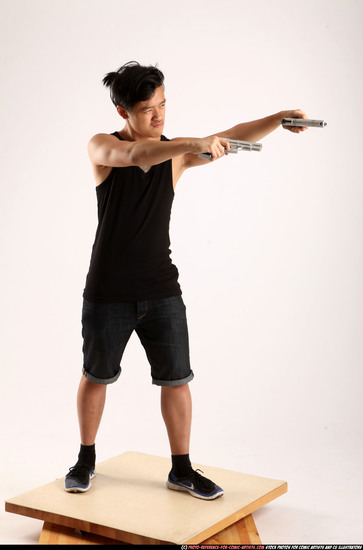 Man Young Athletic Fighting with gun Standing poses Casual Asian