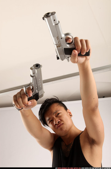 Man Young Athletic Fighting with gun Standing poses Casual Asian